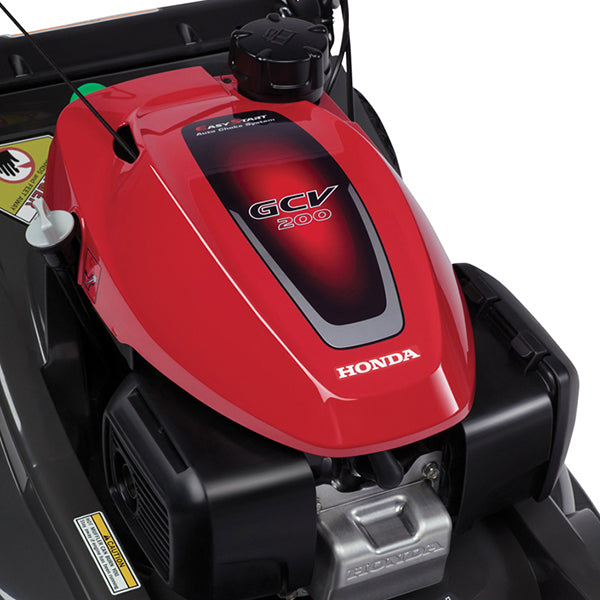 Honda HRX217K5VKA 21-inch gas lawn mower with 187cc engine and Versamow 4-in-1 system, shown with engine close-up.